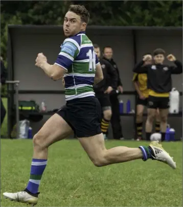  ??  ?? Gorey’s Stephen Duke runs the pitch for his intercept try.