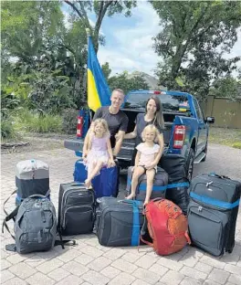  ?? ADVENTHEAL­TH GLOBAL MISSIONS/COURTESY PHOTOS ?? Julia and Oleg Kostyuk with their daughters Elise, 5, and Kate, 4, before leaving for Ukraine. Julia and Oleg recently returned from Ukraine after a humanitari­an trip.