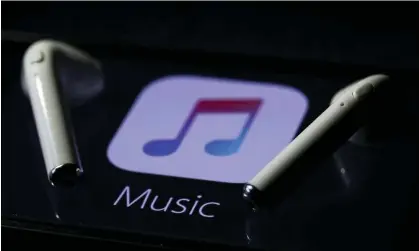  ?? Photograph: Anadolu Agency/Getty Images ?? Spotify argues that restrictio­ns benefit the tech company’s rival app, Apple Music.