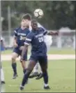  ??  ?? Nottingham’s Franklin Hytegha, front, heads the ball while he’s challenged by Ewing’s Scott Silagt, back, druing Monday afternoon’s game. (John Blaine/ For The Trentonian)