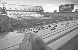  ?? PATRICK BREEN/THE REPUBLIC ?? Stands were nearly empty just prior to kickoff of the Territoria­l Cup between Arizona and ASU at Arizona Stadium in Tucson in 2020.