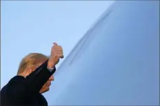  ?? Patrick Semansky/Associated Press ?? President Donald Trump gestures as he boards Air Force One on Wednesday at Andrews Air Force Base, Md.