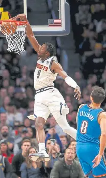  ?? Matthew Stockman, Getty Images ?? Nuggets forward Jerami Grant dunks Saturday night at the Pepsi Center against his former team, the Oklahoma City Thunder.