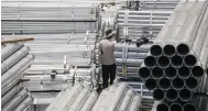  ?? Photo: Bloomberg ?? Steel tubes are bundled in Shanghai, where industrial output slumped after Covid-19 restrictio­ns were imposed in April.