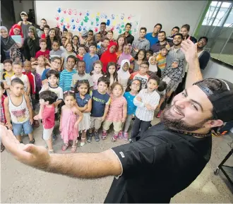  ?? LYLE ASPINALL/FILES ?? Mohamed El-Rafih, creator of an anti-radicaliza­tion program called Fostering Youth Inclusiven­ess (or FYI), is seen at a recent graduation ceremony for a summer camp he ran at the Genesis Centre.