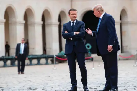  ?? Ian Langsdon / AFP ?? Presidents Emmanuel Macron and Donald Trump at Les Invalides in Paris to mark France’s national day and the centenary of US entry into the First World War. Both are using the internatio­nal stage to address domestic matters