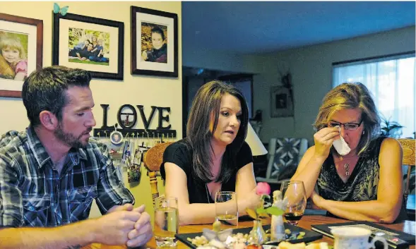  ?? LARRY WONG/EDMONTON JOURNAL ?? From left, Jolene Cote’s husband Mike Cote, her sister Rhonda Berg and mother Dorothy Commandeur discuss her death. On the wall are photos of the Cote family.