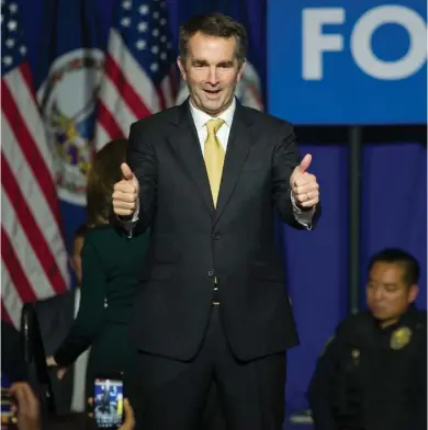  ?? (Photo by Cliff Owen, AP) ?? Virginia Gov.-elect Ralph Northam walks onstage to celebrate his election at the Northam For Governor election night party at George Mason University in Fairfax, Va., Tuesday, Nov. 7, 2017.