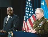  ?? ALEX BRANDON/AP ?? Pentagon chief Lloyd Austin, left, and Joint Chiefs Chairman Gen. Mark Milley talk to the media after a virtual meeting with defense leaders from around the world.