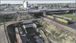  ?? TRIBUNE NEWS SERVICE ?? Highway 180 passes over a trench constructe­d for the California High-Speed Rail project next to the Union Pacific Railroad tracks near G Street in downtown Fresno on Friday, Feb. 17, 2023.