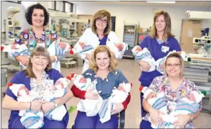  ?? SUBMITTED ?? New Life Center Clinical Director Tracy Bolton, registered nurse, seated, from the left, holds Elsie Rose Muse and Claire Addison Carpenter; Leslie Williams, RN, holds Elizabeth Keely Herrick and Alessandra Guthrie; and Charlene Hendricks, RN, holds...