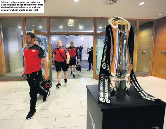  ??  ?? &gt; Leigh Halfpenny and the rest of the Scarlets arrive ahead of the PRO14 final clash with Leinster last term, with the prize everybody wants on the right