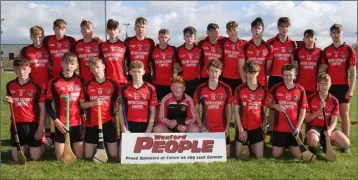  ??  ?? Fionn Codd, the Cloughbawn captain, with David Tobin of Coiste na nOg and Brendan Furlong (sponsors). The runners-up from Oulart-The Ballagh.