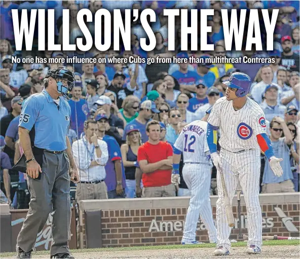  ?? | CHARLES REX ARBOGAST/ AP ?? Willson Contreras has some heated words for home- plate umpire Angel Hernandez, who called him out on strikes to end Monday’s game against the Sox.