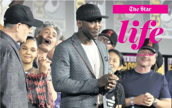  ?? | CHRIS PIZZELLO Invision/AP ?? MAHERSHALA Ali, centre, wears a hat to promote his new movie Blade at the Marvel Studios panel on day three of Comic-Con Internatio­nal in San Diego on Saturday.