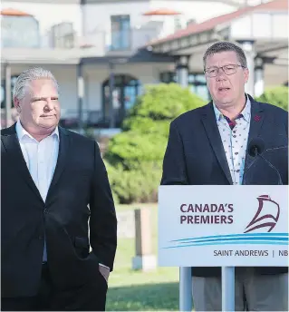  ?? THE CANADIAN PRESS/ANDREW VAUGHAN ?? Ontario Premier Doug Ford, left, and Saskatchew­an Premier Scott Moe have joined forces to fight the federal government plan to impose a national carbon tax.