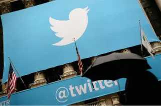  ?? AFP PHOTO ?? DOWNWARD SPIRAL
This file photo taken on Nov. 7, 2013 shows a banner with the Twitter logo at the New York Stock Exchange. Twitter’s owner Elon Musk has pledged the platform will not become a ‘hellscape,’ but experts fear a staff exodus following mass layoffs may have devastated its ability to combat misinforma­tion, impersonat­ion and data theft.
