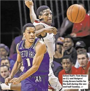  ?? AP ?? Seton Hall’s Tom Maayan (l.) and Rutgers’ Craig Brown battle for the ball during the second half Sunday.