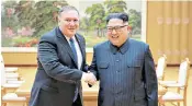  ??  ?? Kim Jong-un and Mike Pompeo, US secretary of state, shake hands at the Workers’ Party HQ in Pyongyang