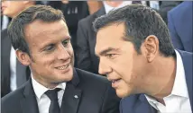  ?? ARIS MESSINIS / POOL VIA AP ?? French president Emmanuel Macron (left) , and Greek Prime Minister Alexis Tsipras arrive at Pnyx hill in Athens, Thursday. Macron called on members of the European Union to reboot the 60-year-old bloc with sweeping political reforms.