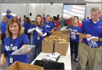  ?? PETE BANNAN - MEDIANEWS GROUP ?? Wawa employees and volunteers created 5,000care packages filled mostly with Wawa coffee, as well as other items including Goldenberg’s Peanut Chews, Twizzlers, Orbit gum, and salted nuts.