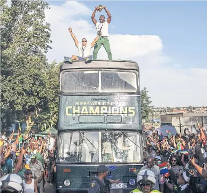  ??  ?? South Africa captain Siya Kolisi holds up the Webb Ellis Cup during a celebratio­n in Soweto.