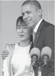  ?? NICOLAS ASFOURI, AFP/GETTY IMAGES ?? President Obama hugs prodemocra­cy leader Aung San Suu Kyi on Nov. 19, 2012, in Yangon, Myanmar. Suu Kyi’s party won elections in 2015, ending decades of military dictatorsh­ip.