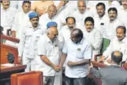  ?? ARIJIT SEN/HT PHOTO ?? ▪ Karnataka chief minister HD Kumaraswam­y greets newly elected speaker KR Ramesh Kumar during a special session to prove the majority of the CongressJD(S) coalition at the assembly in Bengaluru on Friday.