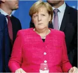  ??  ?? German Chancellor Angela Merkel reacts at the final election rally in Munich in this Sept. 24 photo. (Reuters)