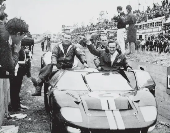  ?? AP ?? Above: A jubilant Chris Amon waves to the crowd after he and Bruce McLaren won the 1966 24 Hours of Le Mans.