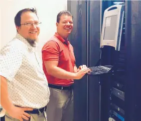  ?? COURTESY OF ADVANCED NETWORK MANAGEMENT ?? Senior consulting engineer Eric Geib, left, and consulting engineer Andrew Garcia work in Advanced Network Management’s server room at the firm’s office in the North I-25 industrial corridor.