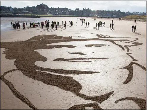  ??  ?? Members of the public gather on West Sands Beach, St Andrews, for filmmaker Danny Boyle’s Pages of the Sea