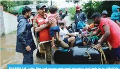  ?? — AFP ?? ERNAKULAM, India: Fire and rescue personnel evacuate residents in an inflatable boat from a flooded area in Muppathada­m near Eloor in Kerala yesterday.