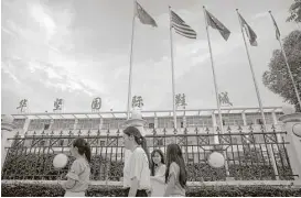  ?? Mark Schiefelbe­in / Associated Press ?? Internatio­nal flags fly at a Huajian Group shoe factory in Ganzhou in southern China’s Jiangxi Province. The manufactur­er has come under scrutiny after activists investigat­ing labor conditions there were detained.