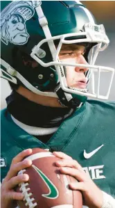  ?? CARLOS OSORIO/AP ?? Michigan State quarterbac­k Payton Thorne warms up Nov. 19 in East Lansing, Michigan.