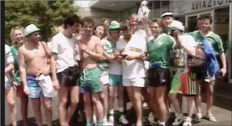  ??  ?? Jimmy O’Toole (green shorts) with Irish fans at Italia 90.