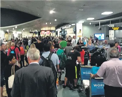  ??  ?? Disembarki­ng passengers trying to get through Auckland Airport’s arrivals hall on Sunday night said it appeared there were only two officers at passport control but NZ Customs says there were 10 across all of its queues.