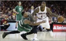  ?? TONY DEJAK — ASSOCIATED PRESS ?? Iman Shumpert drives on the Celtics’ Marcus Smart during the second half on May 21 at Quicken Loans Arena.