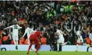  ?? Photograph: Phil Noble/Reuters ?? Karim Benzema runs to the fans after scoring Real Madrid’s fifth goal in superb style.