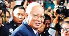  ?? MOHD RASFAN/AFP ?? Former Malaysian prime minister Najib Razak leaves court in Kuala Lumpur in April after facing trial over alleged involvemen­t in the looting of sovereign wealth fund 1MDB.