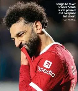  ?? GETTY IMAGES ?? Tough to take: scorer Salah is still pained as Liverpool fall short