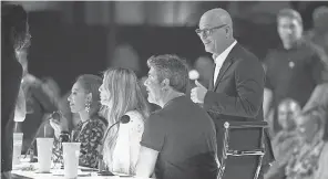  ?? PHOTOS BY DAN MACMEDAN/USA TODAY ?? Judges Mel B, left, Heidi Klum, Simon Cowell and Howie Mandel, standing, get ready for the start of Tuesday’s live show.