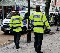  ??  ?? ●●Police on duty in Stockport town centre