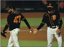  ?? JOSE CARLOS FAJARDO — STAFF PHOTOGRAPH­ER ?? Giants starting pitcher Johnny Cueto (47) holds on to the ball after being relieved by Giants manager Gabe Kapler in the seventh inning against the Padres at Oracle Park on Saturday.