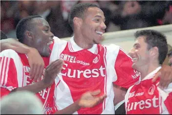  ?? — AFP ?? In this file photo taken on May 5, 1997 Monaco’s players Victor Ikpeba, Thierry Henry and John Collins celebrate after winning the French Ligue 1 championsh­ip match against Caen. Former Arsenal star Thierry Henry was on October 13 named as Monaco coach, the struggling Ligue 1 club announced. The 41-year-old French World Cup winner, who had been working as an assistant coach for the Belgian national team, signed a contract through until June 2021.