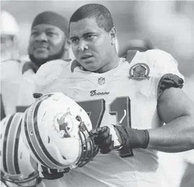  ?? WILFREDO LEE/The Associated Press file photo ?? Miami Dolphins tackle Jonathan Martin was subjected to “a pattern of harassment” that included racist slurs and vicious
sexual taunts about his mother and sister by three teammates, according to a report ordered by the NFL.