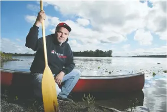  ?? JULIE OLIVER ?? Writer Randy Boswell included a few spiritual — and colourful — companions to join him in his canoe as he paddled back in time to Kettle Island (in rear), leaving from the Gatineau side of the Ottawa River.