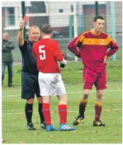  ??  ?? Two players being sent off after the fight. One player from each side.