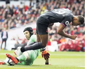  ?? AP ?? Arsenal goalkeeper Petr Cech (left) tackles Everton’s Dominic Calvert-Lewin during their English Premier League match at the Emirates Stadium yesterday.