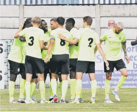  ??  ?? Darius Osei celebrates with his South Shields team-mates after scoring against Blyth Spartans. Picture by Kev Wilson.